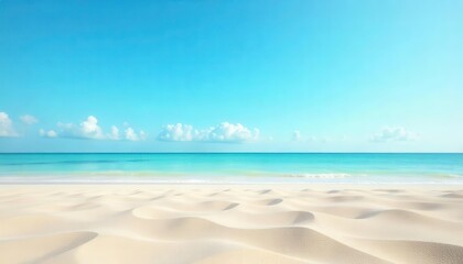 Obraz premium Wide sandy beach under a bright blue sky with calm waves