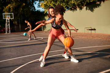 Bounce, basketball and women playing game together for competition, challenge and fitness on...