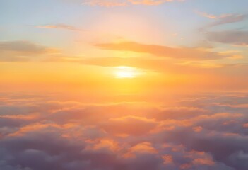 Fototapeta premium A breathtaking view of a sunrise above soft clouds, showcasing warm colors and serene beauty in the sky.