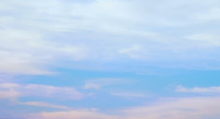 a clear afternoon sky with beautiful white clouds