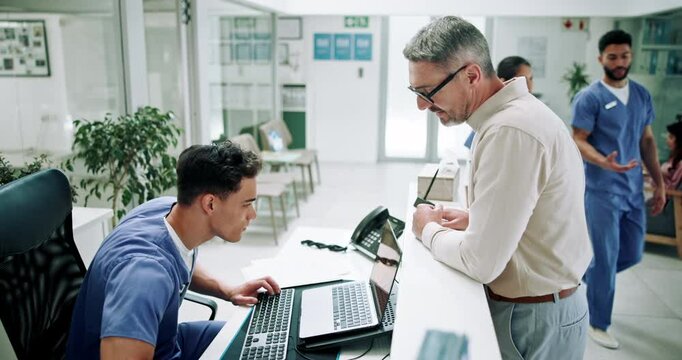 Hospital, nurse on computer and man in lobby for appointment, consultation and medical service. Healthcare, clinic and mature patient at administration desk for help, check in and collect medicine