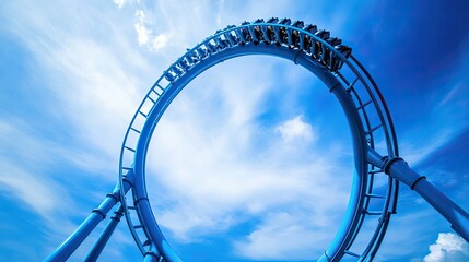Roller Coaster Loop Against a Blue Sky with Clouds