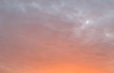 A beautiful pink and orange sky with clouds