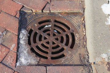 metal drain on the cobbled street
