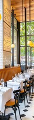 Empty restaurant tables with white tablecloths and glasses.