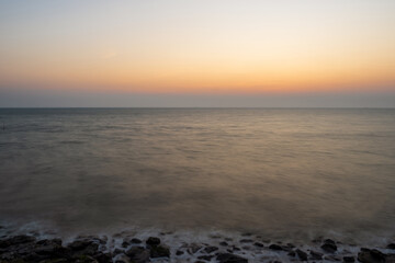 Fototapeta premium Sunset sea panorama long exposure view landscape horizon beautiful summer season shore nobody wind wave cool holiday look calm sky twilight evening day time nature tropical coast ocean water travel