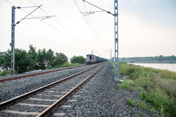 Railway track in India. Indian Railways Diesel-Electric Multiple Unit train