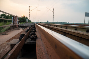 Naklejka premium Railway track in India. Indian Railways Diesel-Electric Multiple Unit train