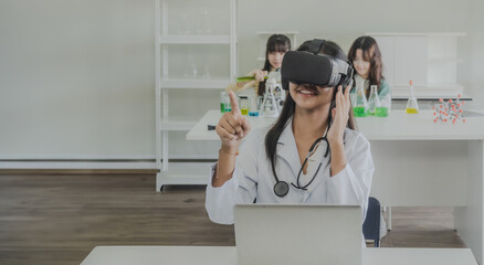 Child kid girl asian young student one people endication learning and smile have fun happy with science lab technology with in classroom look hand holding 3D glasses virtual simulation technology