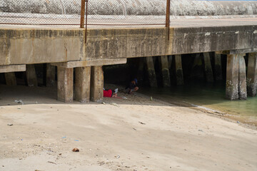 Homeless under a bridge, Thailand