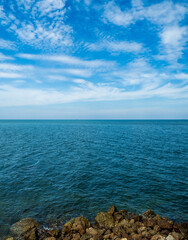 Landscape beautiful summer vertical horizon look view point rock shore open sea beach cloud clean and blue sky background calm nature ocean wave water nobody travel at thailand chonburi sun day time