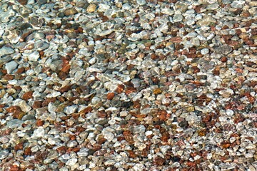 Pebbles in the Ionias sea at Alikes beach in Aigio town. Peloponnese. Greece. Europe.