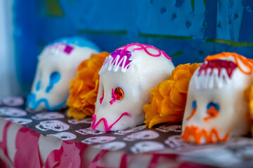 Three decorated sugar skulls, which are a traditional element of the Day of the Dead, in Spanish: "Día de los Muertos" celebration in Mexico.