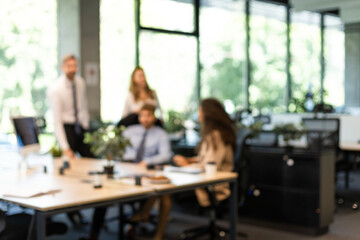 Businessmen blur in the workplace in office with computer or shallow depth of focus of abstract background