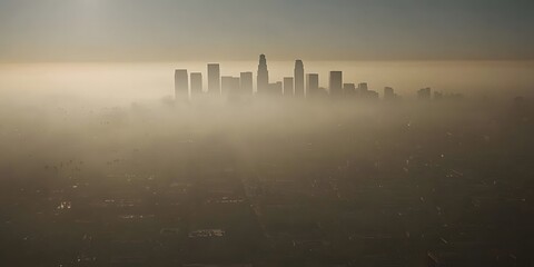 Fototapeta premium photo of air pollution over city skyline visible through the smog, clouds, white sky