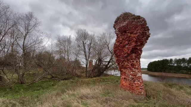 Ruins of the Ancient Wall of Piltene Castle by the Old Venta Riverbed on a Cloudy Autumn Day in Courland, Latvia - Static Video