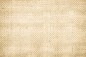 Closeup detail of beige fabric texture background. High resolution photo.