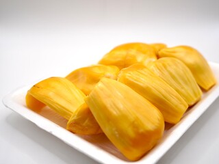 Close up image of golden-yellow flesh of ripe jackfruit isolated on a white background. Sweet of flesh jackfruit