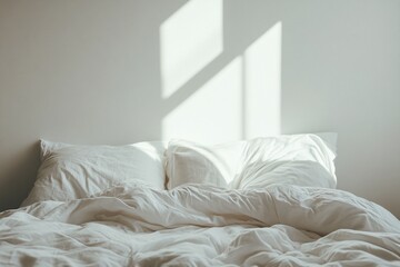 Serene Bedroom with White Linens and Blank Wall