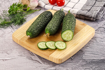 Raw green cucumbers with slices