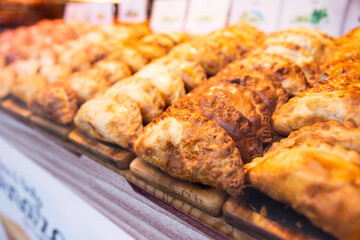 Freshly baked empanadas with different fillings for sale