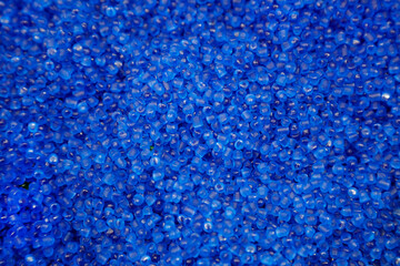 The pile of blue pellets materials for plastic injection process. The raw material from petrochemical products.