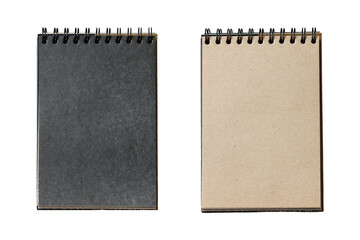 Two open spiral bound notebooks with black and brown pages on white background