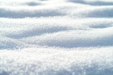 Obraz premium A close-up view of sparkling snow with gentle undulations and a soft, white texture.