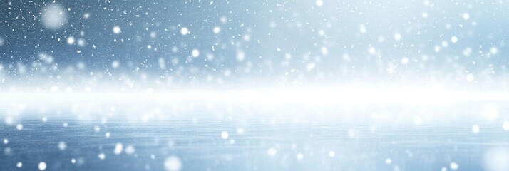 A serene winter scene with falling snowflakes and a soft, blurred horizon.