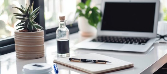 A sleek desk features a laptop, notebook, and pen paired with vitamin bottles, emphasizing a balance between productivity and health. the clean, modern setup suggests a focused