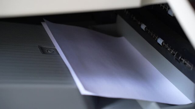 Office printer quickly prints information on paper close-up