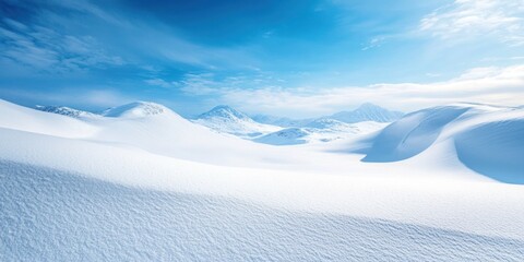 A serene winter landscape featuring rolling snow-covered hills under a bright blue sky.