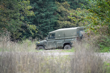 a British army Land Rover Wolf utility vehicle moving through countryside