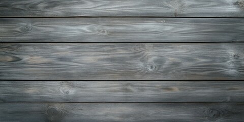 Gray wooden planks forming a rustic surface in natural light