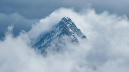 A mountain peak barely visible through clouds, suggesting hidden strength and the journey toward clarity. Exploration with strength and challenge.