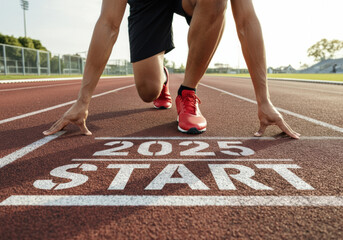 Athlete preparing to sprint from the start line marked for the year 2025 during a sunny day at a running track