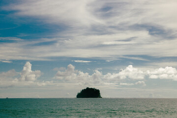 view of the sea in the middle there is a small island