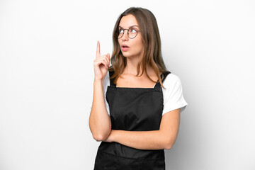 Young caucasian restaurant waiter woman isolated on white background thinking an idea pointing the finger up