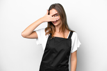 Fototapeta premium Young caucasian restaurant waiter woman isolated on white background covering eyes by hands and smiling