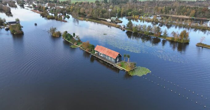 Small recreational houses at Scheendijk, water and recreational area, Loosdrechtse plassen. Aerial drone video