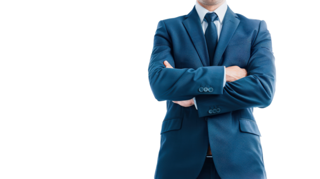 Confident businessman with arms crossed in a suit.