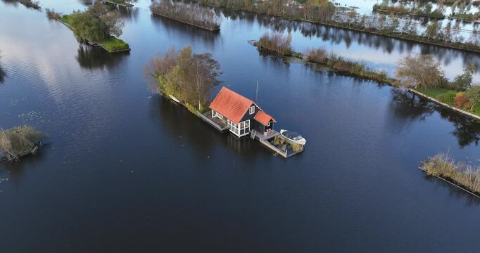 Small recreational houses at Scheendijk, water and recreational area, Loosdrechtse plassen. Aerial drone video