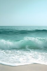 Fototapeta premium Mesmerizing Ocean Waves Cascading Onto a Pristine Beach with a Serene Seafoam Green and White Color