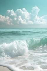 Obraz premium Serene Beachfront Scene with Turquoise Ocean Waves and Fluffy White Clouds in Tropical Paradise