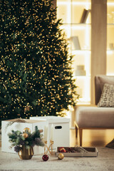 Cozy living room with Christmas tree and festive decorations.
