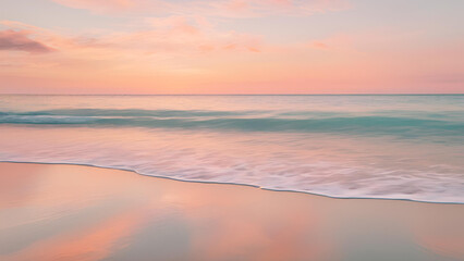 Serene Sunset Seascape:  A breathtaking panoramic view of a tranquil beach at sunset, showcasing the soft hues of pink and orange in the sky reflected in the gentle waves.