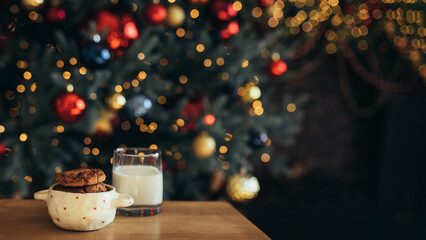 Chocolate Christmas cookies and milk in a festive living room.