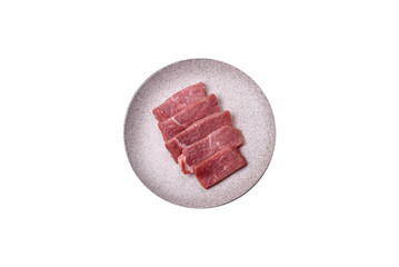Juicy beef cut into slices with salt, spices and herbs