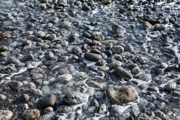 Sea water on a rocky shore. Beautiful nature, recreation and tourism. Background. Space for text.