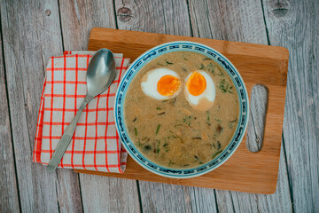 Traditional Czech Creamy Mushroom Soup Kulajda with Egg, Potatoes, and Dill